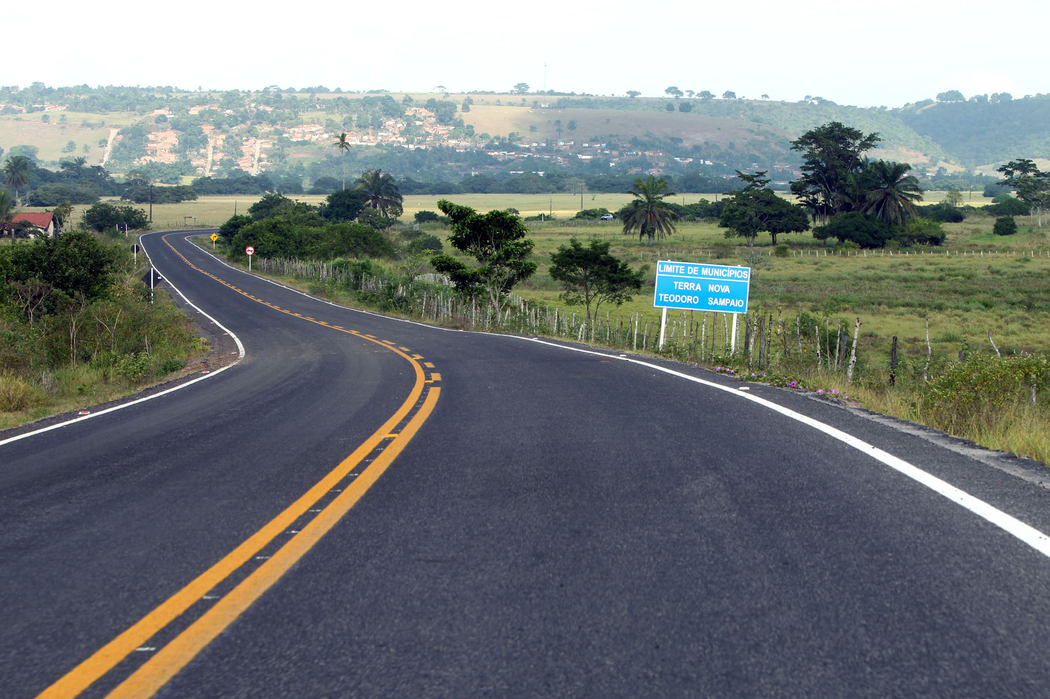 a deserted highway leading into the distance on a clear day