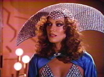 a woman with curly hair wearing a blue bikini and holding a silver umbrella