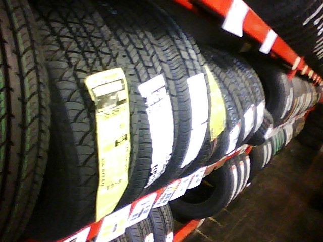 a stack of new tire tires for sale