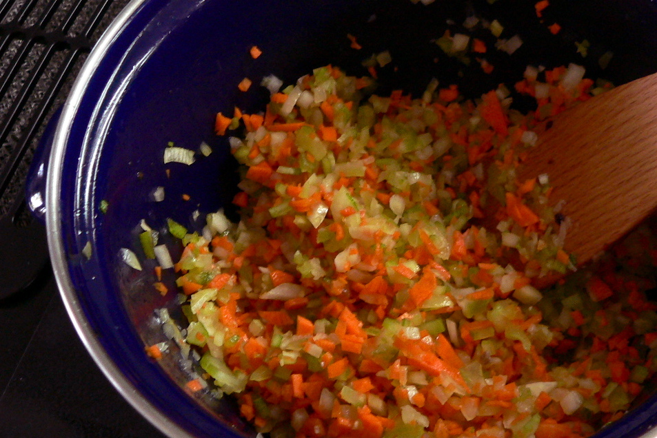 a bowl filled with chopped carrots and onions