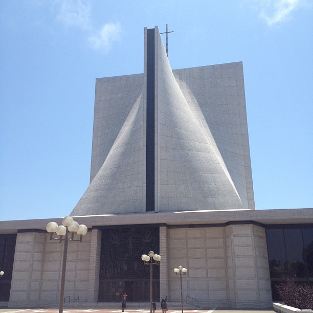 the front entrance of an church against a blue sky