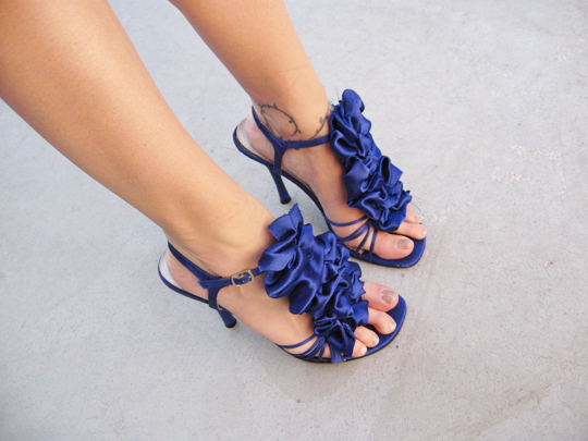 woman's feet wearing high heel blue sandals