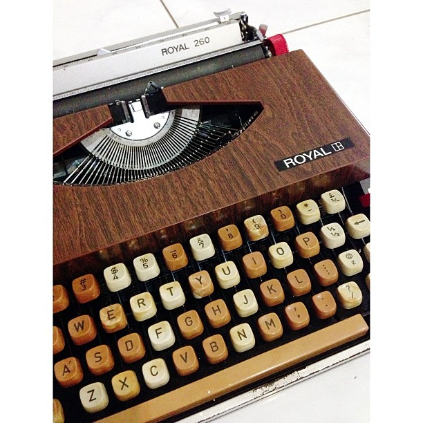 the royal 25 typewriter has two keys and is made of wood and ivory