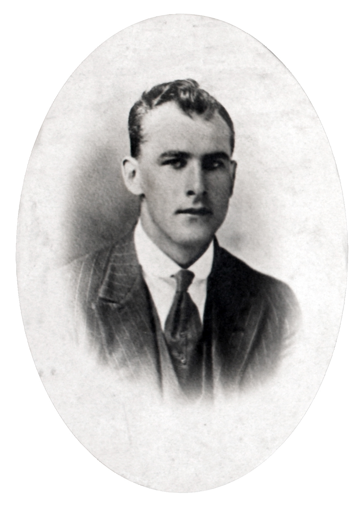 an old black and white po of a young man in suit and tie