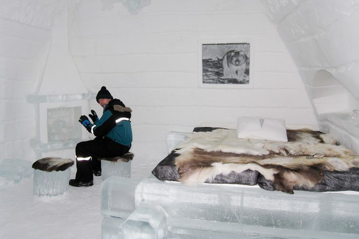 a snow bed room with a snowman in the corner