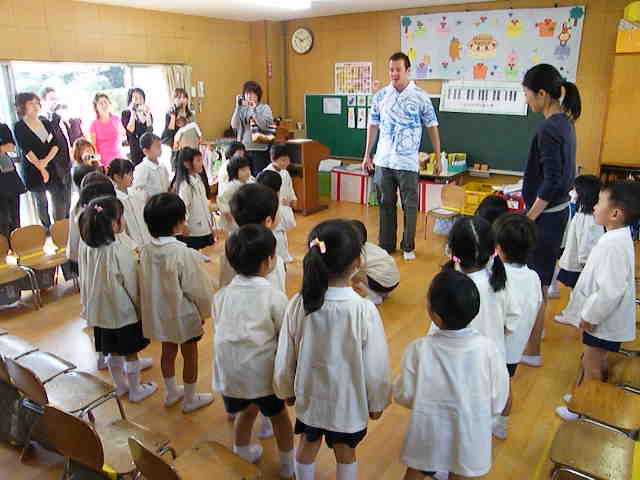 a couple of boys and girls talking to children