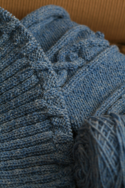 blue wool yarn is spooled in this pograph