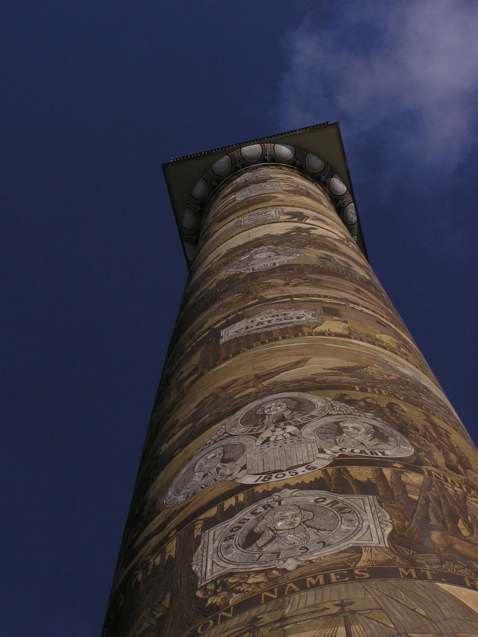 a large tower has a clock and face