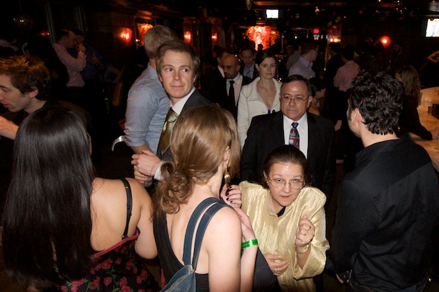 a group of people are gathered around at a party