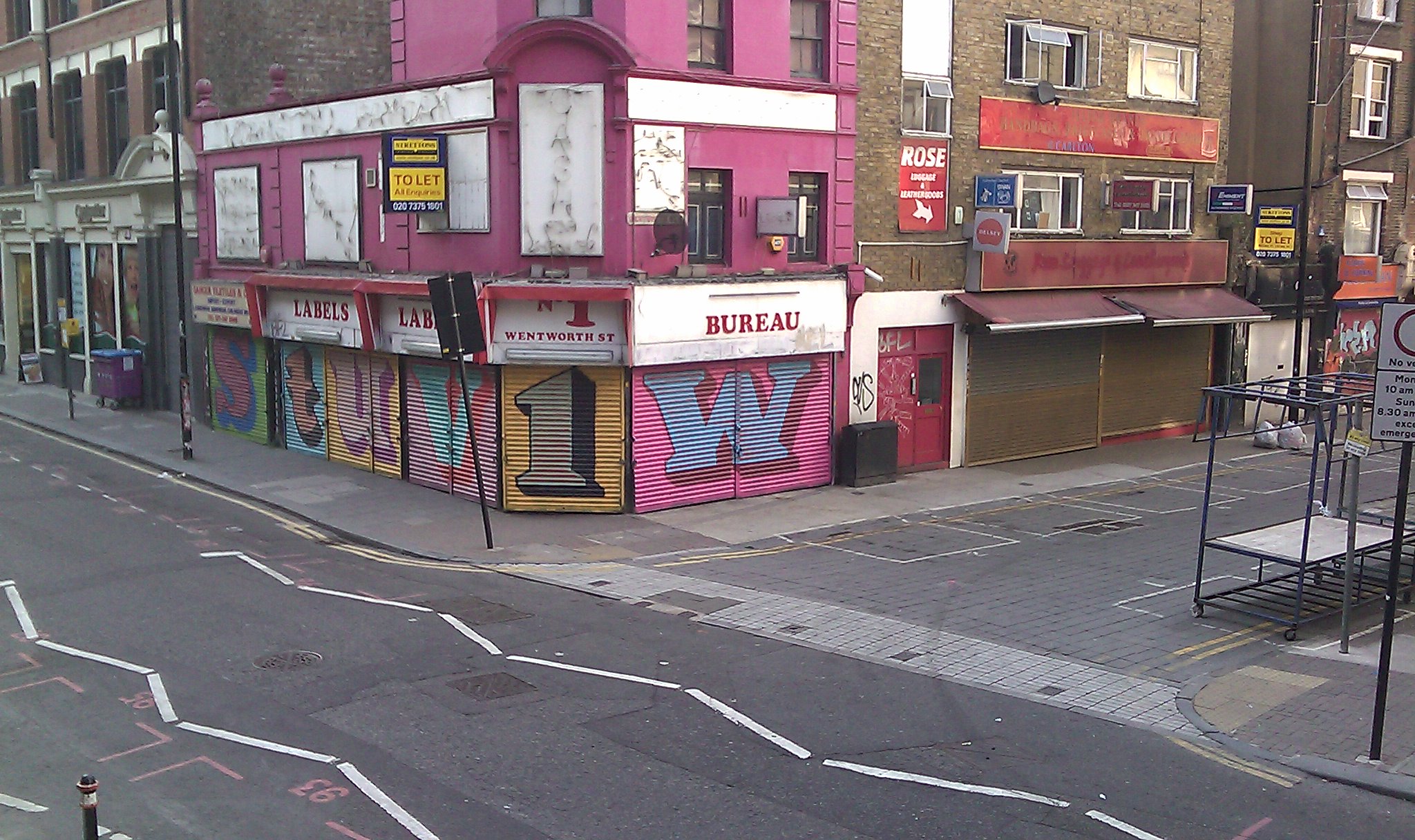 an old store that has been painted pink