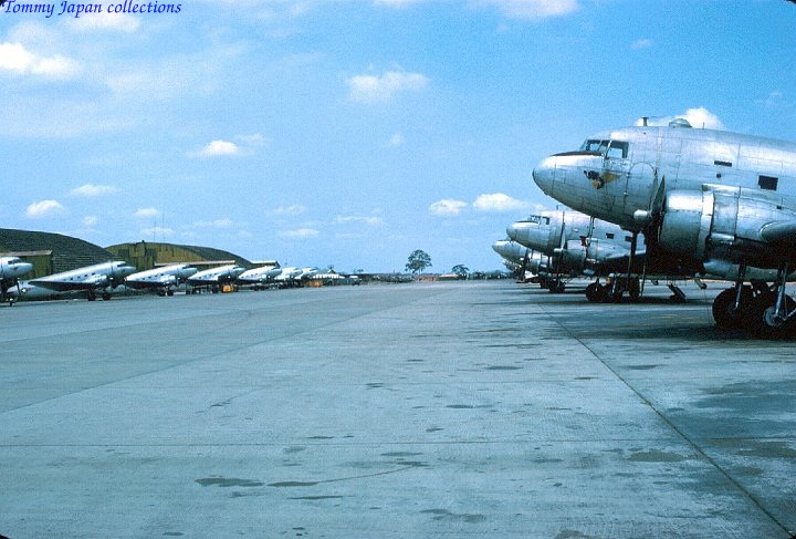 a group of airplanes sit on the tarmac