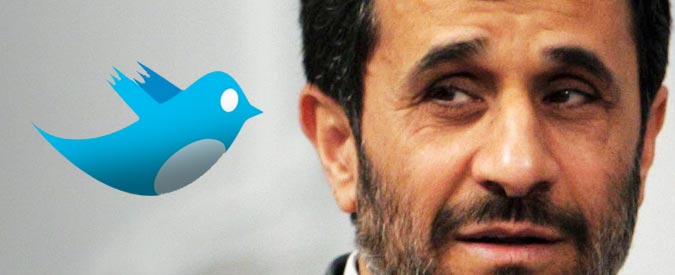 a man in a suit and tie with twitter logo