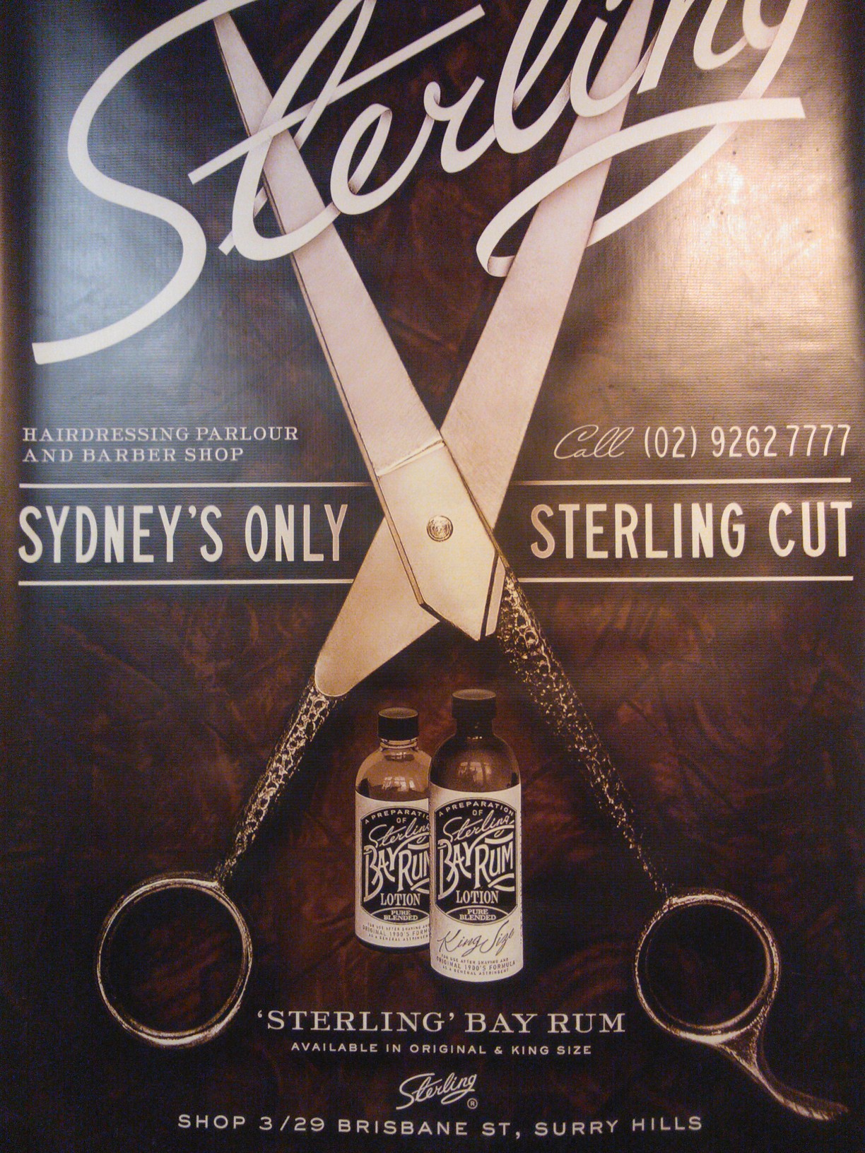 a poster on a wooden table depicting scissors, jars and chains