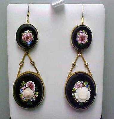 some earrings with flowers and gold chains