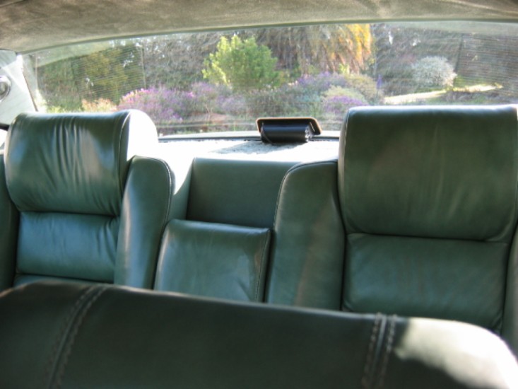 the interior of a vehicle, showing the seats and tables