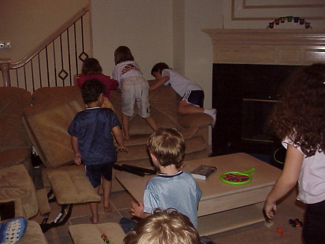 several s standing around playing a video game