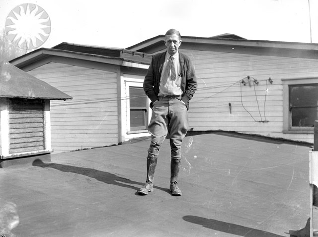 an old po of a man standing on the porch