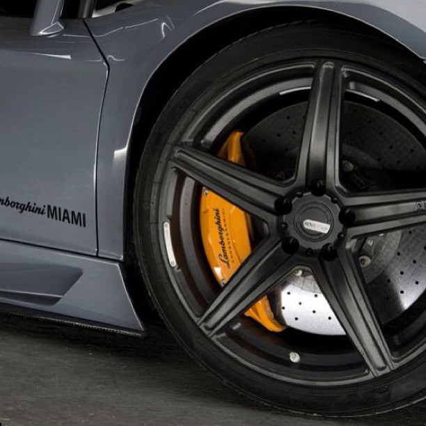 a close up of the spokes of a sports car