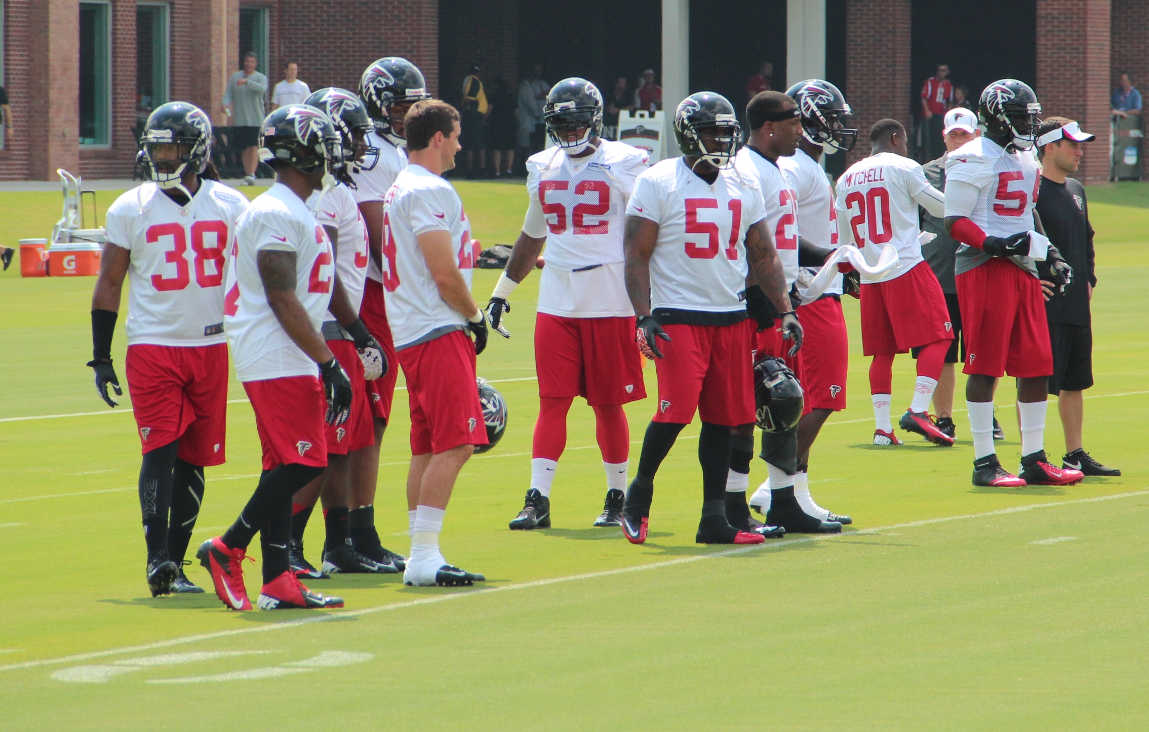 a team wearing uniforms standing on the field