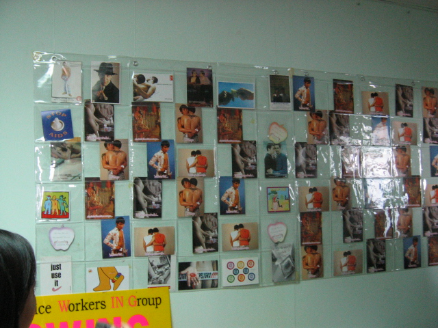 a wall covered with pictures and various stickers