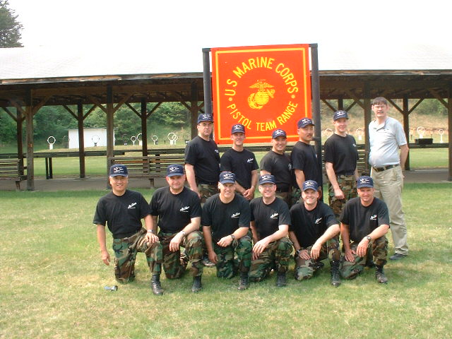 a group of people in uniforms posing for a picture