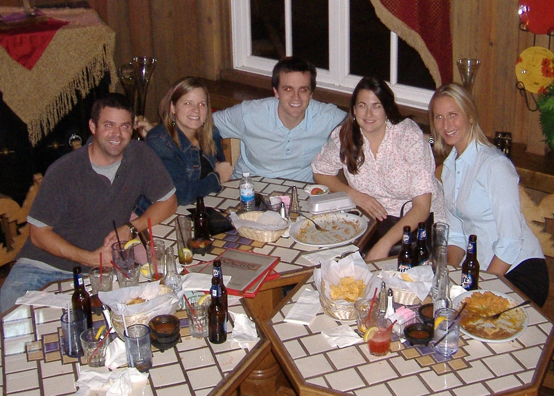 a group of people sitting around a table