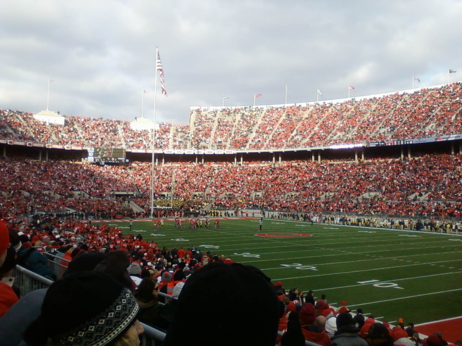 a stadium full of spectators and a football field