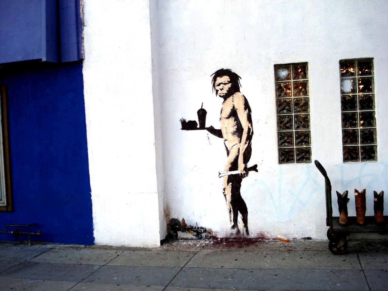 a mural with a man in shorts on the side