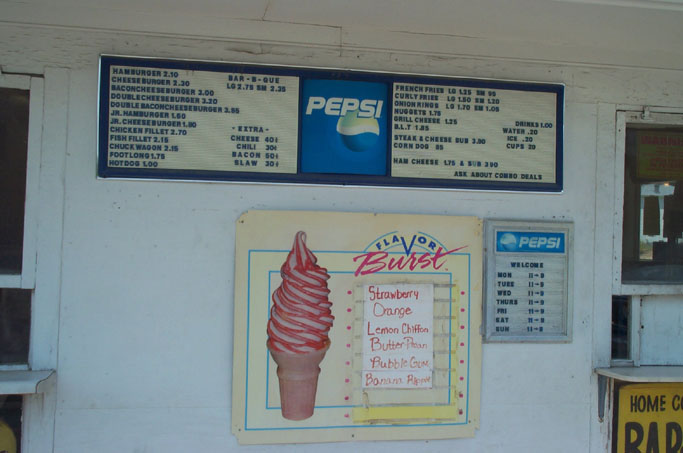 signs showing different types and colors of ice cream