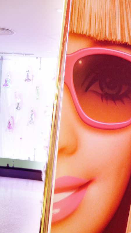 a close up of a woman's face in a mirror with sunglasses on it