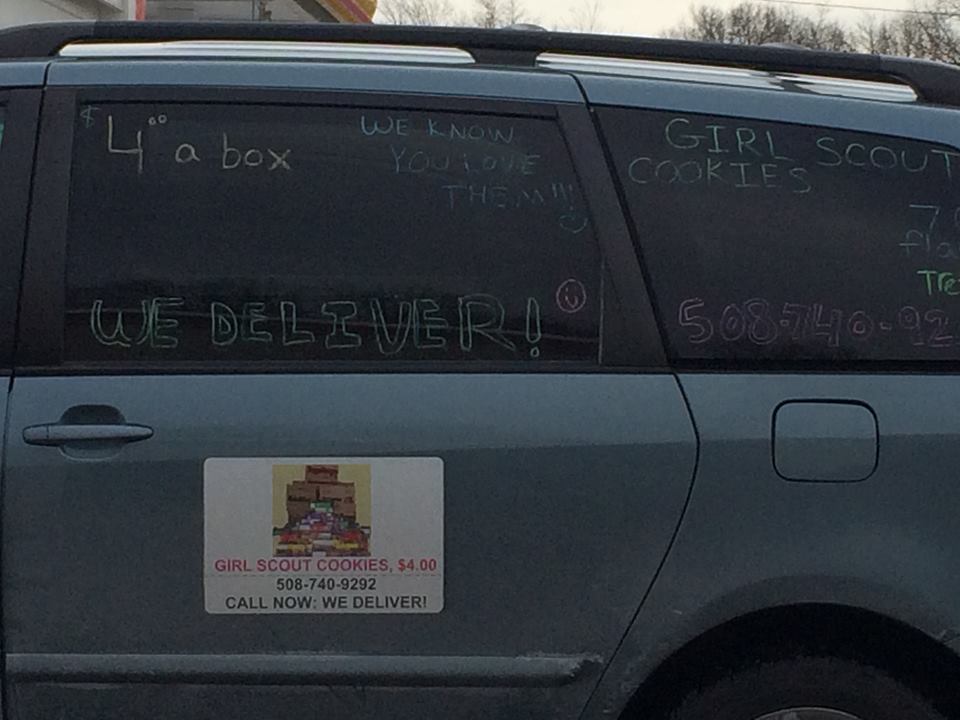 the back view of a parked vehicle with writing on the side