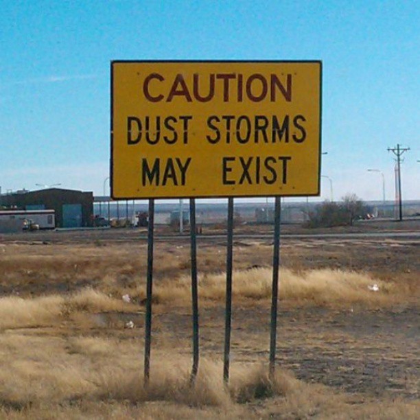 there is a sign that says caution, duststorms may exist