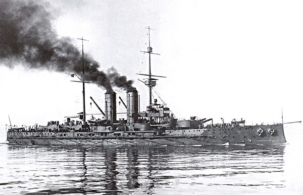 a battleship sitting on top of a body of water
