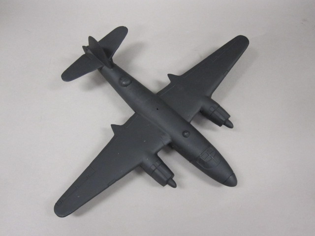 a small model airplane in the shape of a fighter plane