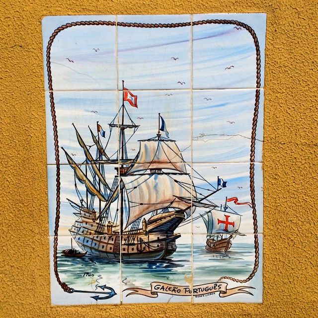 a decorative tile painting depicting a ship