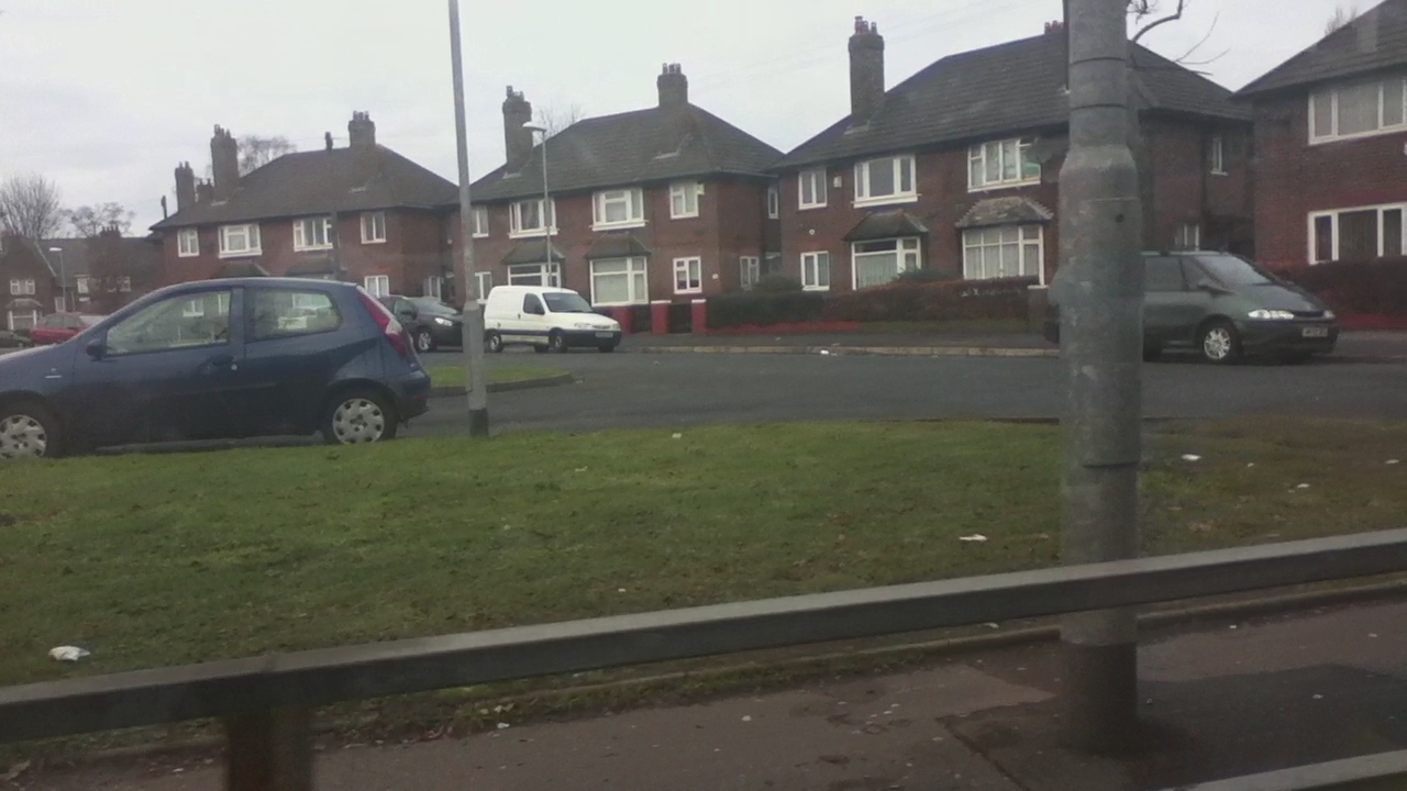 two cars are parked on the side of the road