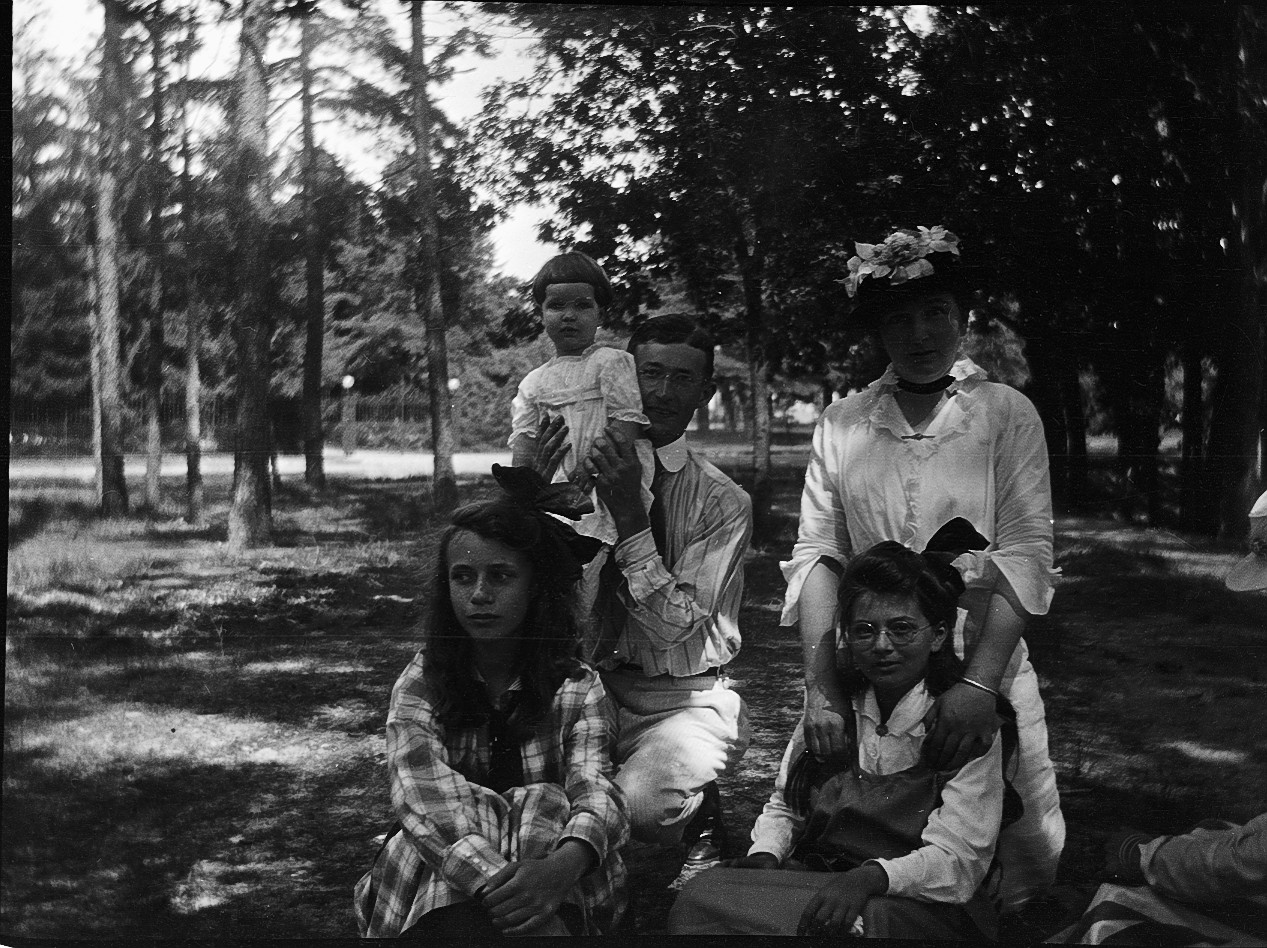 people with a dog pose for a po in the woods