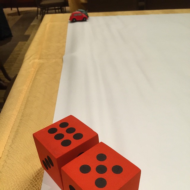 a pair of dices on top of a white sheet