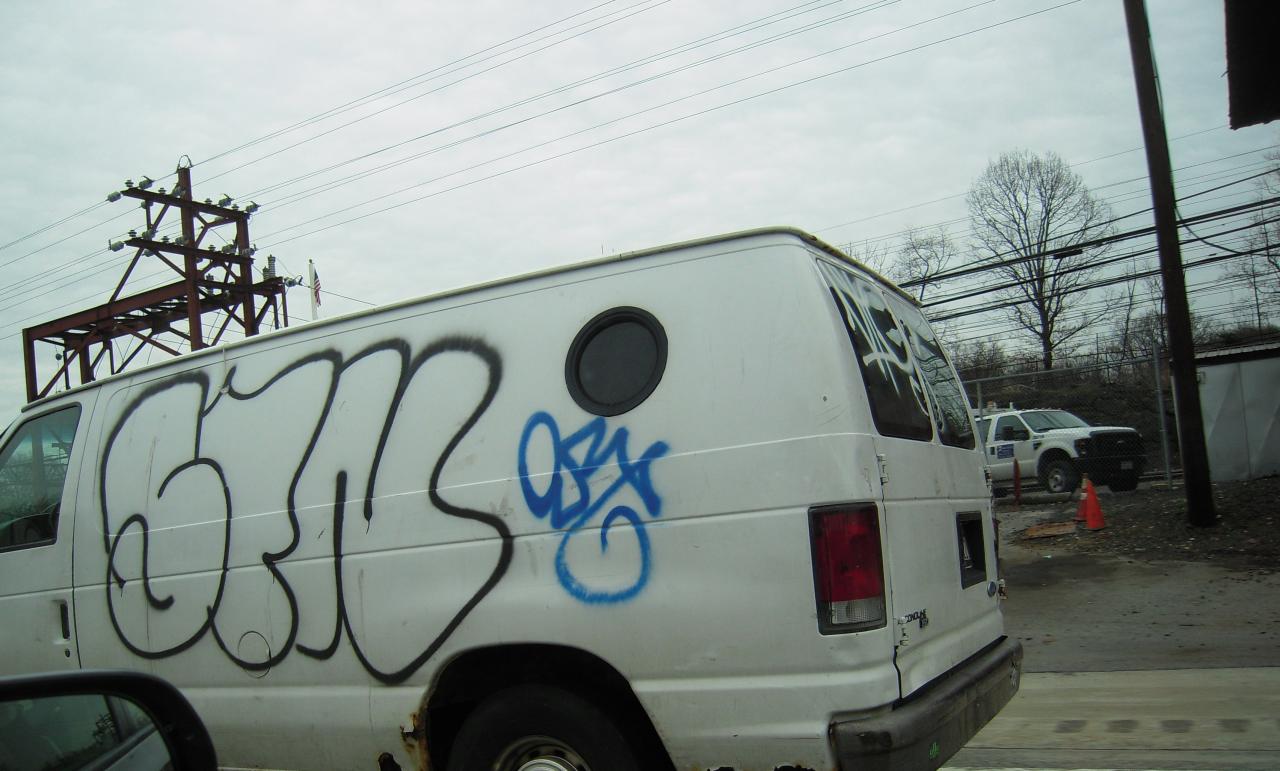 a van has been vandalized with graffiti