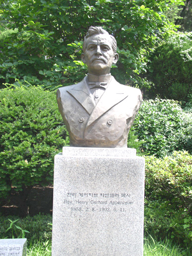 a statue of a person wearing a suit and tie