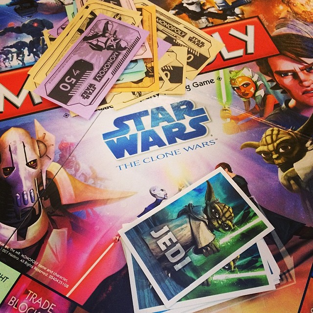 a table full of star wars games that looks like they are getting their names written