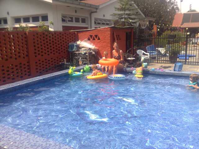 children are playing in the swimming pool