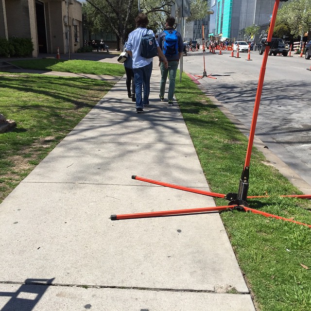 the fallen street sign was clearly visible for people to see