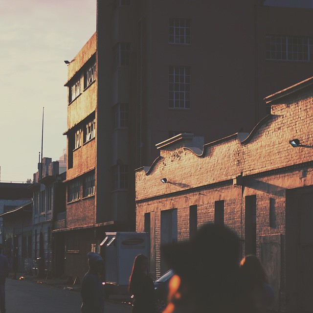 a bunch of people walk around on the street