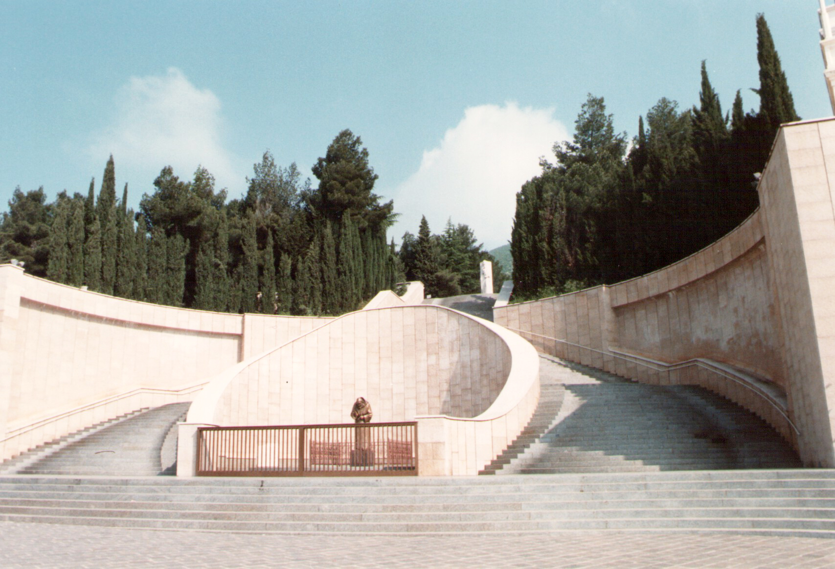 a cement wall with stairs going up to it