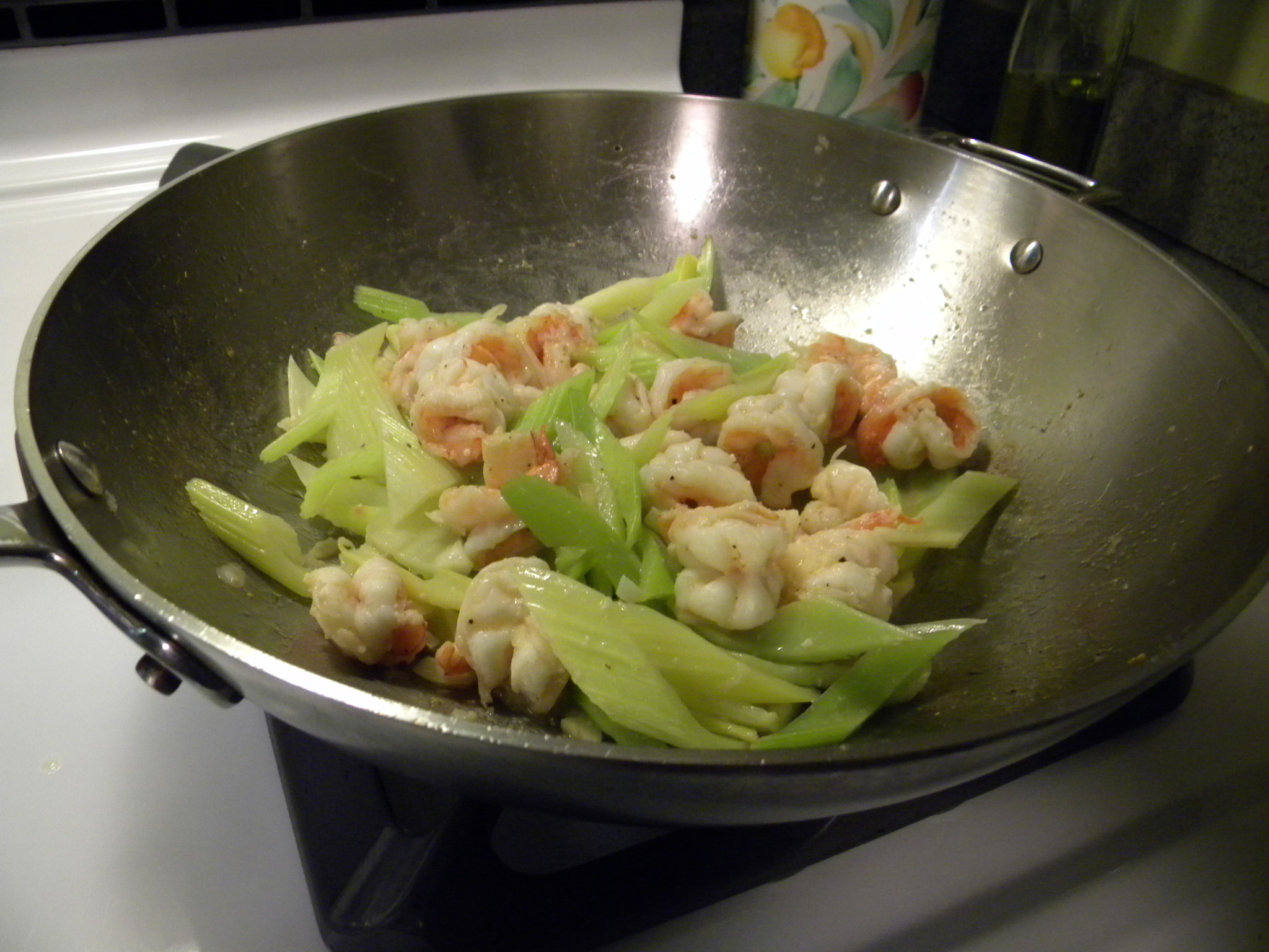 a pan full of food that is sitting on a stove