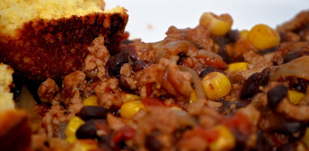 meat and corn are mixed into an interesting meal