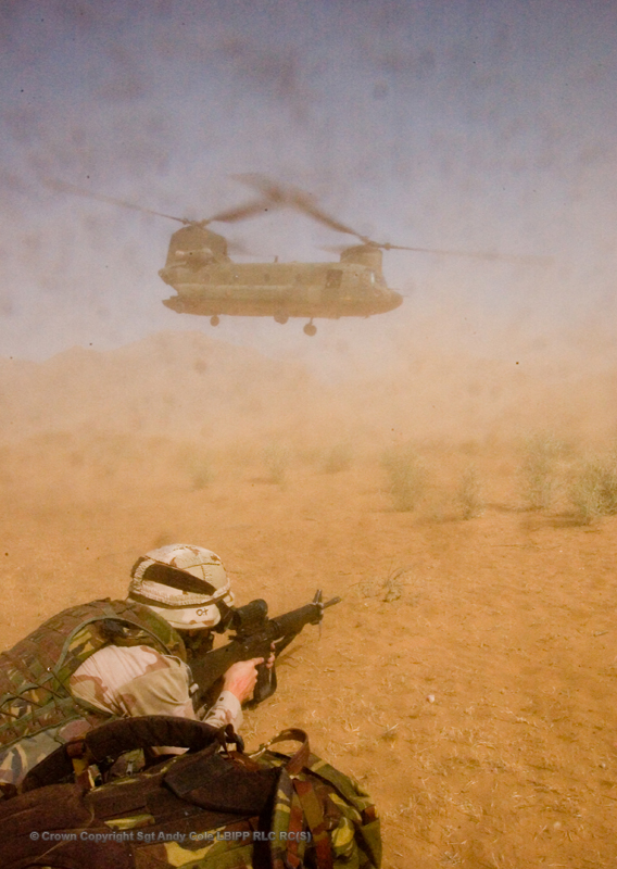 a helicopter hovering over a person with a gun