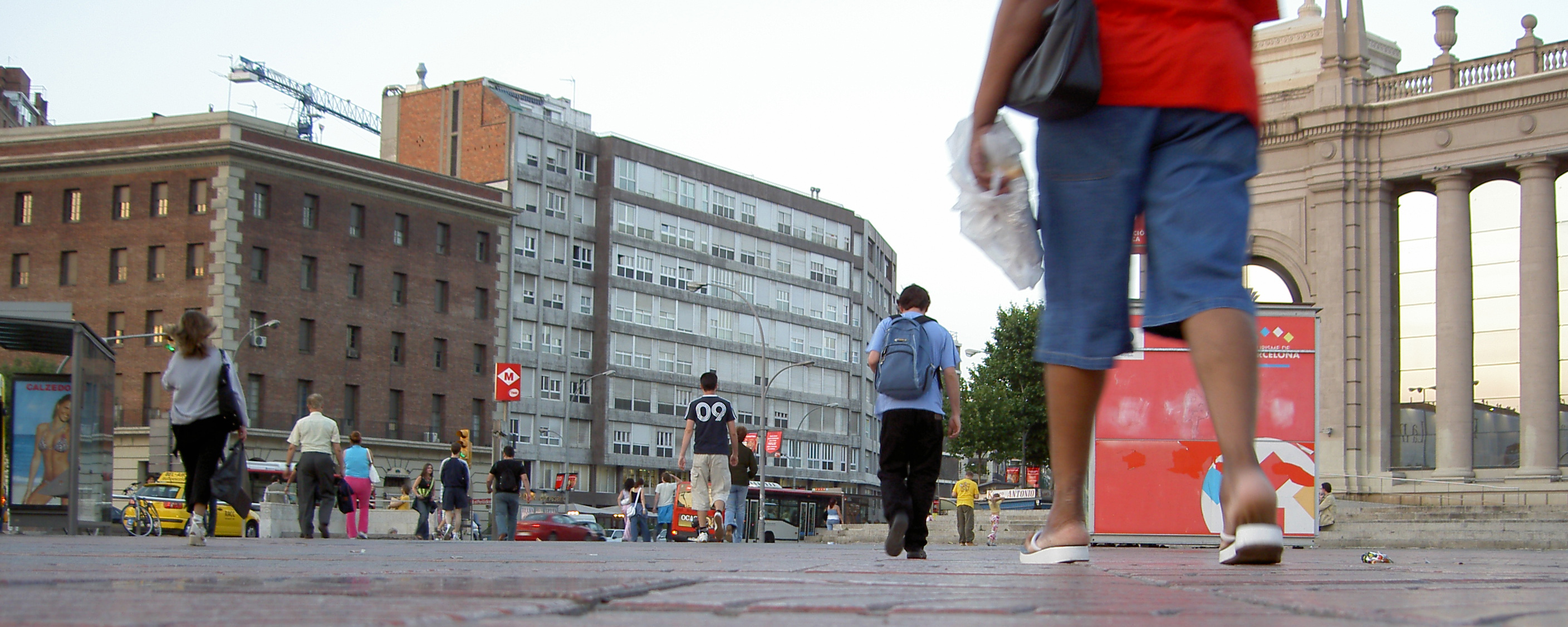 several people are standing outside in the city