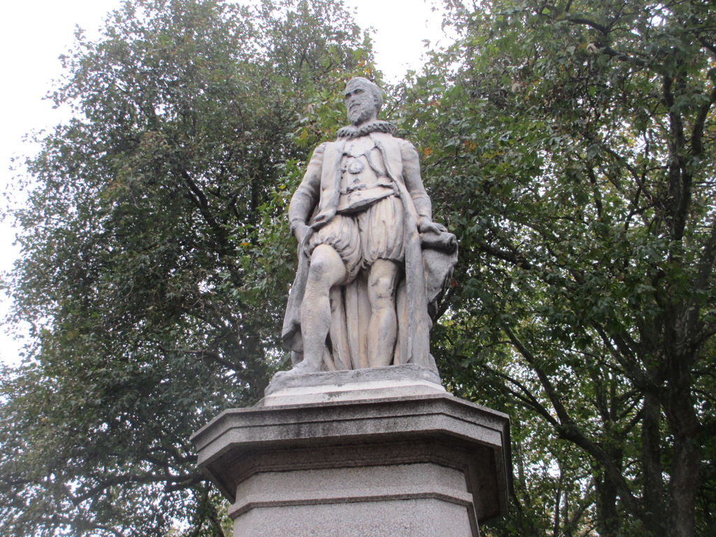 a statue is shown by some trees